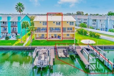 Stunning waterfront townhome just steps from the beach! Built in