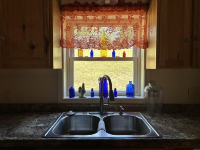 Affordable 3 or 4 bedroom home on Lake Catherine with permitted