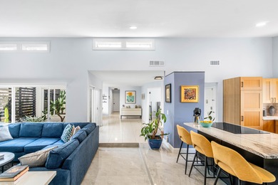 Beautiful golf course views surround this bright and inviting