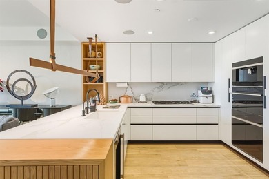 Designer-curated North East Corner residence! This sought-after