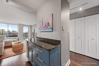 Welcome to this beautifully updated top-floor 1-bedroom, 1-bath