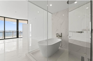 Welcome to luxury living in the sky! This brand-new corner unit