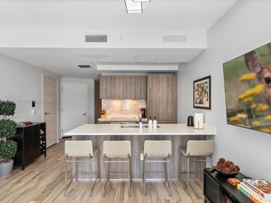 High above Brickell, this stunning SLS LUX residence offers a