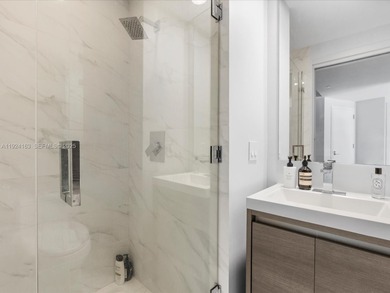 High above Brickell, this stunning SLS LUX residence offers a