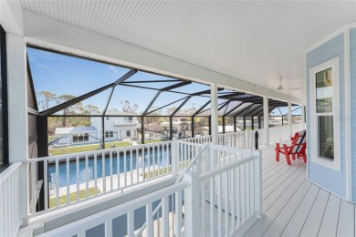 Completed in 2021, this CUSTOM-DESIGNED WATERFRONT RETREAT