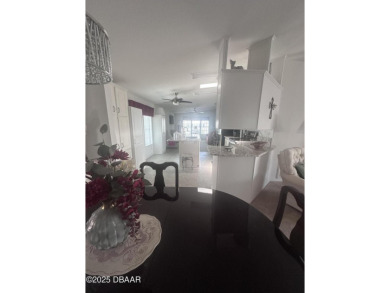 This immaculate home in a 55-plus community is move-in ready and