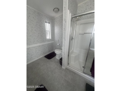 This immaculate home in a 55-plus community is move-in ready and