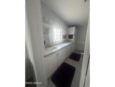 This immaculate home in a 55-plus community is move-in ready and