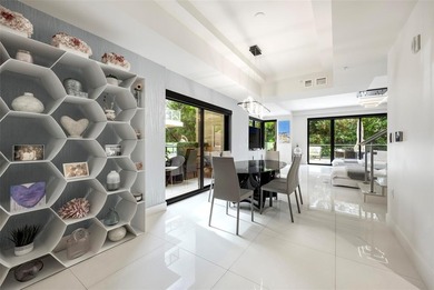 Beach-chic 2-story contemporary glass wrapped corner residence