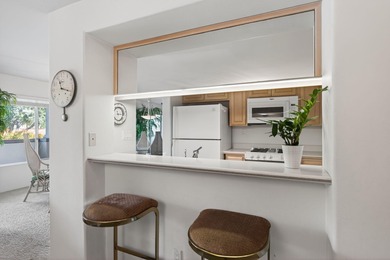 Nestled in the coveted El Escorial Villas just steps from East