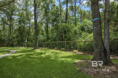 Located just one mile from downtown Fairhope, this 4BR/3.5BA