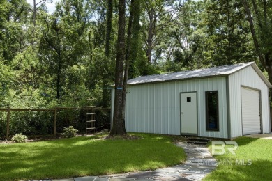 Located just one mile from downtown Fairhope, this 4BR/3.5BA