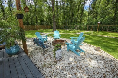 Located just one mile from downtown Fairhope, this 4BR/3.5BA