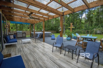 Located just one mile from downtown Fairhope, this 4BR/3.5BA