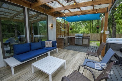 Located just one mile from downtown Fairhope, this 4BR/3.5BA