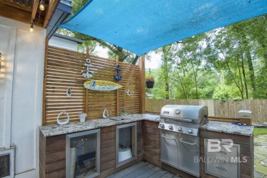 Located just one mile from downtown Fairhope, this 4BR/3.5BA