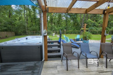 Located just one mile from downtown Fairhope, this 4BR/3.5BA