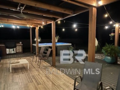 Located just one mile from downtown Fairhope, this 4BR/3.5BA