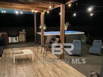 Located just one mile from downtown Fairhope, this 4BR/3.5BA