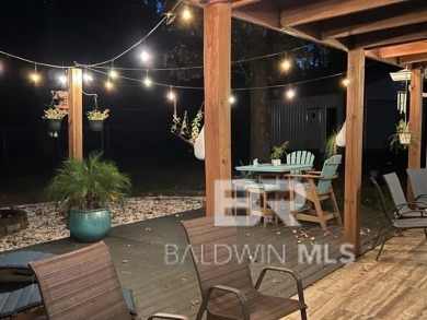 Located just one mile from downtown Fairhope, this 4BR/3.5BA