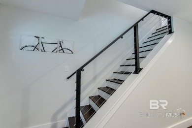 Located just one mile from downtown Fairhope, this 4BR/3.5BA