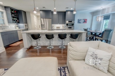 Located just one mile from downtown Fairhope, this 4BR/3.5BA