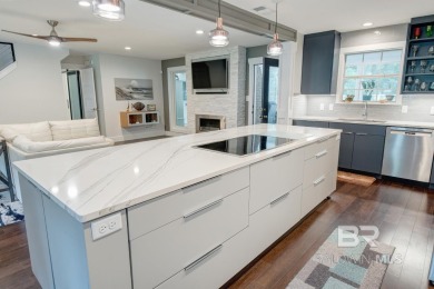 Located just one mile from downtown Fairhope, this 4BR/3.5BA