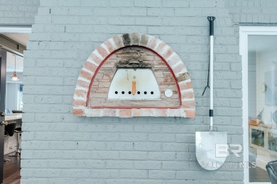 Located just one mile from downtown Fairhope, this 4BR/3.5BA