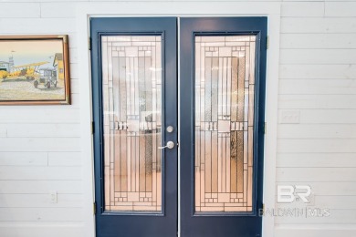 Located just one mile from downtown Fairhope, this 4BR/3.5BA