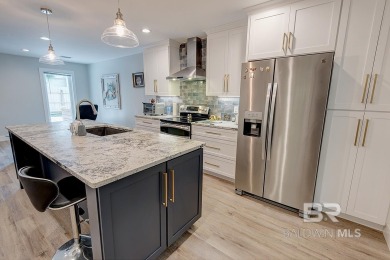 Located just one mile from downtown Fairhope, this 4BR/3.5BA