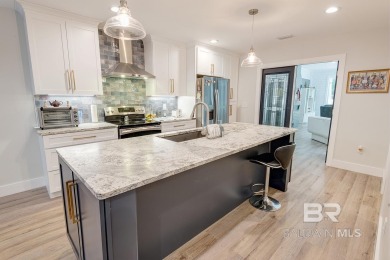 Located just one mile from downtown Fairhope, this 4BR/3.5BA