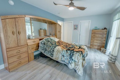 Located just one mile from downtown Fairhope, this 4BR/3.5BA