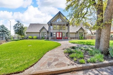 Discover the ultimate lakeside retreat at 2667 Duguid Ln in