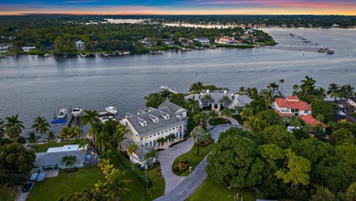 Discover this magnificent custom estate on the Loxahatchee River