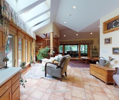 This distinctive architect designed residence with 3 floors and