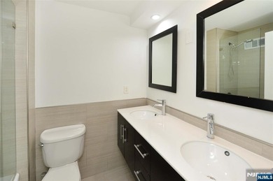 This beautifully renovated 2-bedroom, 2-bath 979 sft condo