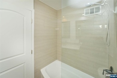 This beautifully renovated 2-bedroom, 2-bath 979 sft condo