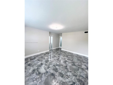 STUNNING HOME IN THE HEART OF TAMARAC. NEW ROOF NEW ELEVATOR ALL