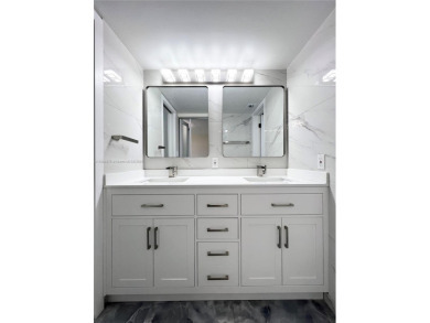 STUNNING HOME IN THE HEART OF TAMARAC. NEW ROOF NEW ELEVATOR ALL