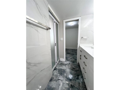 STUNNING HOME IN THE HEART OF TAMARAC. NEW ROOF NEW ELEVATOR ALL