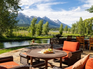 Set on the Snake River with 42.57 acres & dramatic Teton views