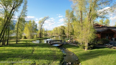 Set on the Snake River with 42.57 acres & dramatic Teton views