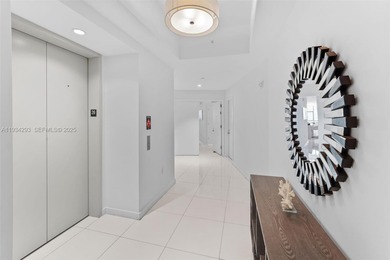 Perched high in the sky on the 26th floor, this exquisite 2