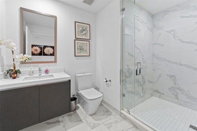 Perched high in the sky on the 26th floor, this exquisite 2