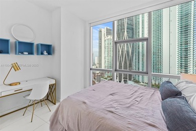 Perched high in the sky on the 26th floor, this exquisite 2