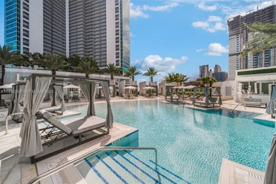 Perched high in the sky on the 26th floor, this exquisite 2