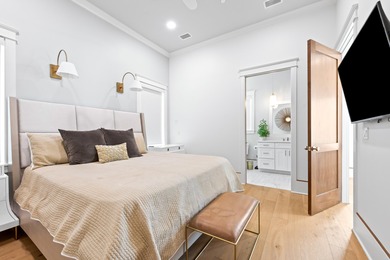 Anchored in the exclusive Palm Court enclave just south of 30A