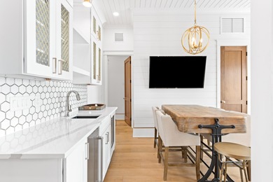 Anchored in the exclusive Palm Court enclave just south of 30A