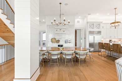 Anchored in the exclusive Palm Court enclave just south of 30A