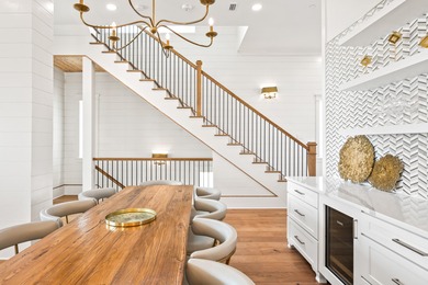 Anchored in the exclusive Palm Court enclave just south of 30A